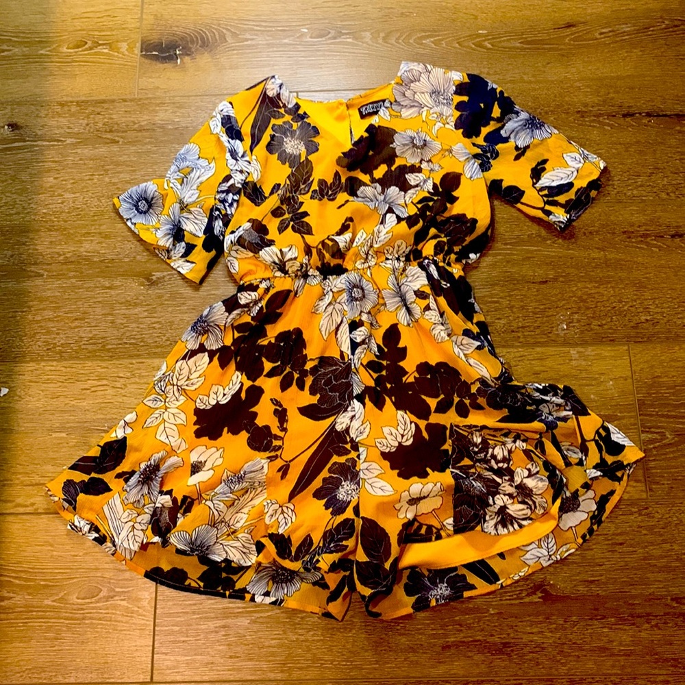 Yellow jumper with flowers on it